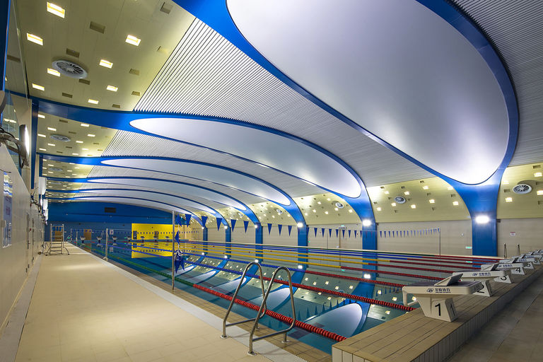 Interior photo of 50m swimming pool and indoor sports hall at Dulwich College Puxi in Minhang, Shanghai.
