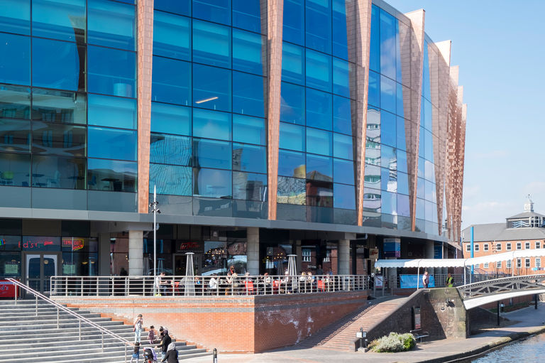 Photo of new glass façade at Barclaycard Arena, overlooking the Brindleyplace canal side development in Birmingham.