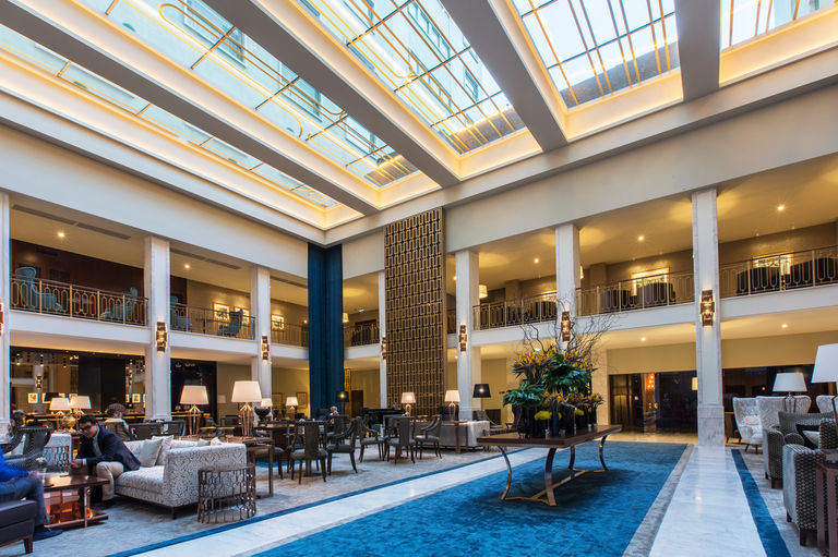 Hotel lobby at Tivoli Avenida Liberdade, transformed with a new glazed ceiling and interior garden.