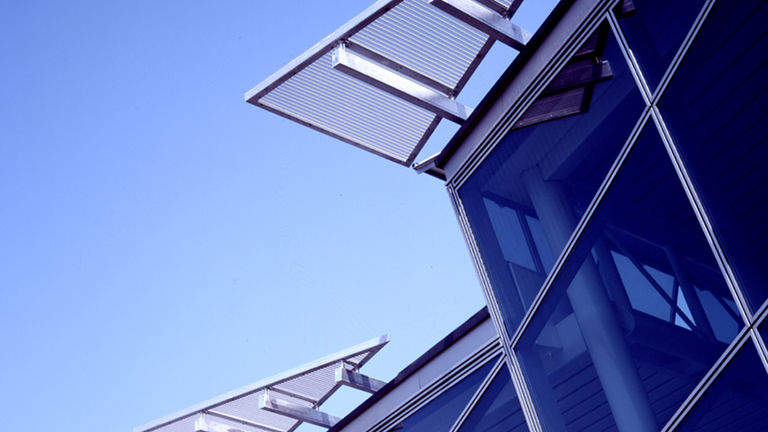 Saw-tooth roof detail, clad in photovoltaic panels, at BP International Centre for Business and Technology in Sunbury.