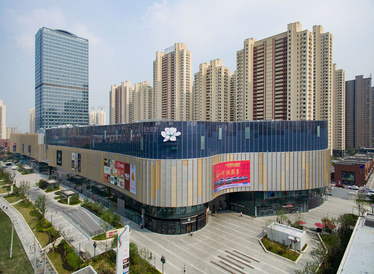 Photo showing contrasting styles of office building and retail block at ID Mall in Hefei, China.