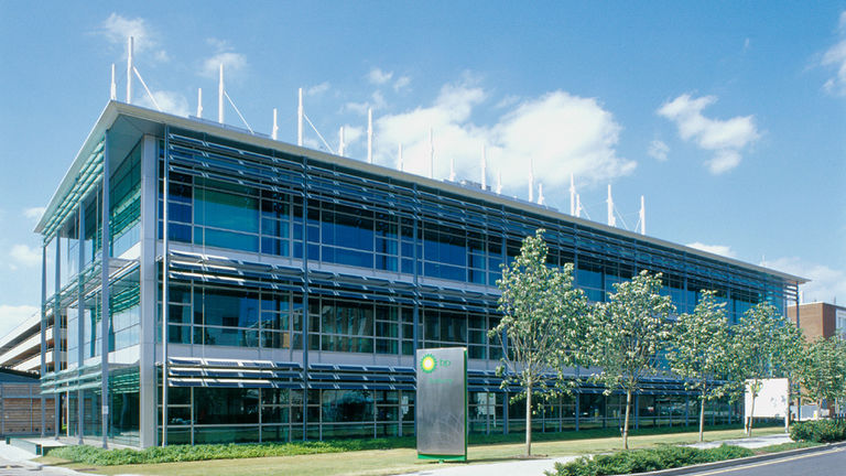 External façade of link building at BP International Centre for Business and Technology, Sunbury campus, featuring photovoltaic panels.
