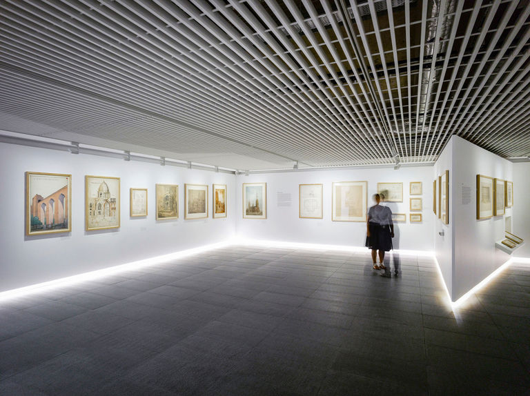 Photo of display walls within the galleries at RIBA North in Liverpool, featuring a continuous shadow gap and recessed lighting.