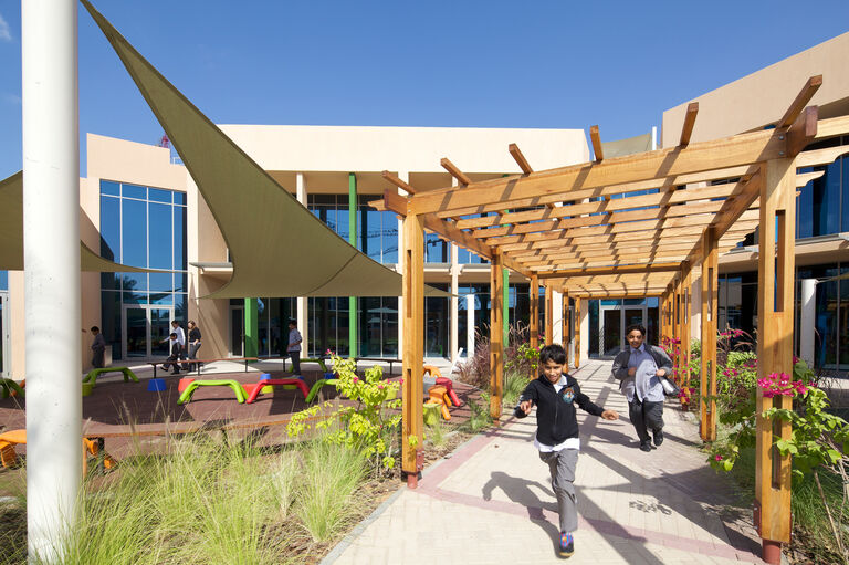 Photo of partially covered outdoor space at ADEC school, UAE.