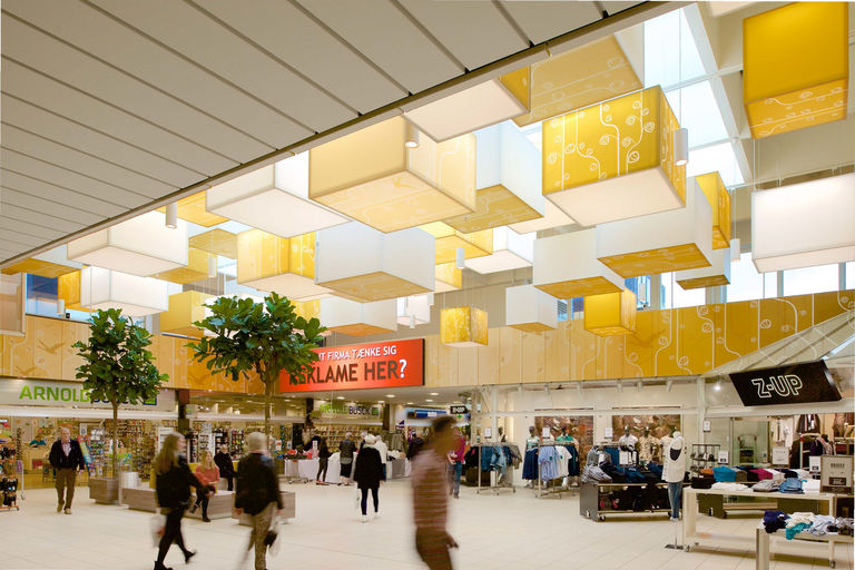 Interior lighting and ceiling design detail at Rosengardecentret retail centre in Odense, Denmark.