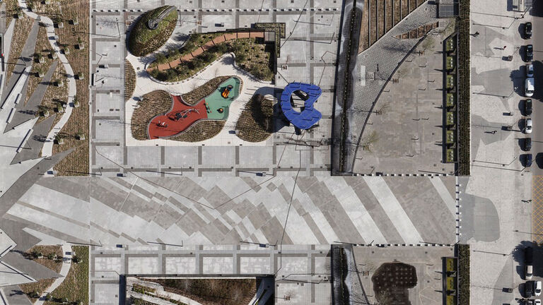 Aerial view of Las Cuato Torres plaza, inspired by Picasso's Guernica painting