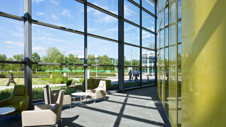 Informal break out spaces and fully glazed façade at BP's Upstream Learning Centre at their Sunbury campus.