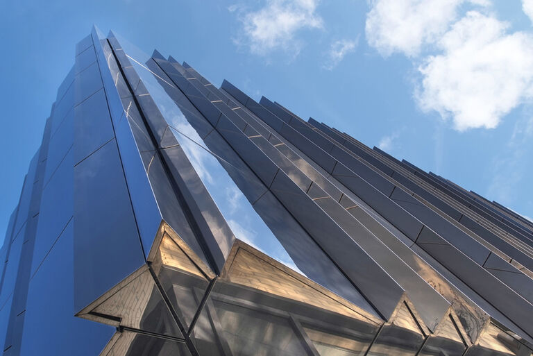 Bronze-tinted mirror glass façade of the Michael Marks Archive Building, a joint venture between retailer Marks & Spencer and the University of Leeds.