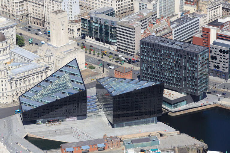 Aerial view of the Mann Island scheme, showing two triangulated new residential buildings and a third commercial block.