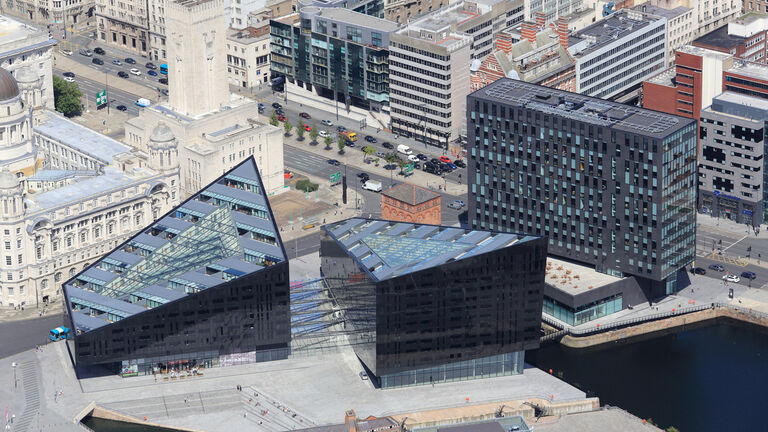 Aerial view of the Mann Island scheme, showing two triangulated new residential buildings and a third commercial block.