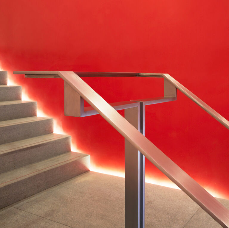 Stair detail at RIBA North, designed in granite underfoot and stainless steel ballustrade.