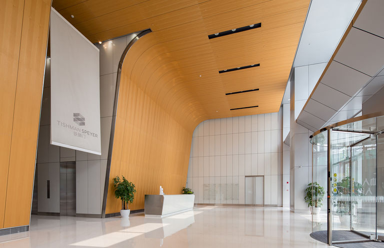 Interior photo of office entrance space for Tishman Speyer at The Summit, their flagship retail and commercial development in Suzhou, China.