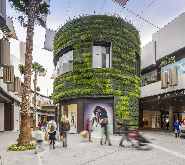 Interior photo of feature green wall at Holea retail and leisure centre in Huelva, Spain.