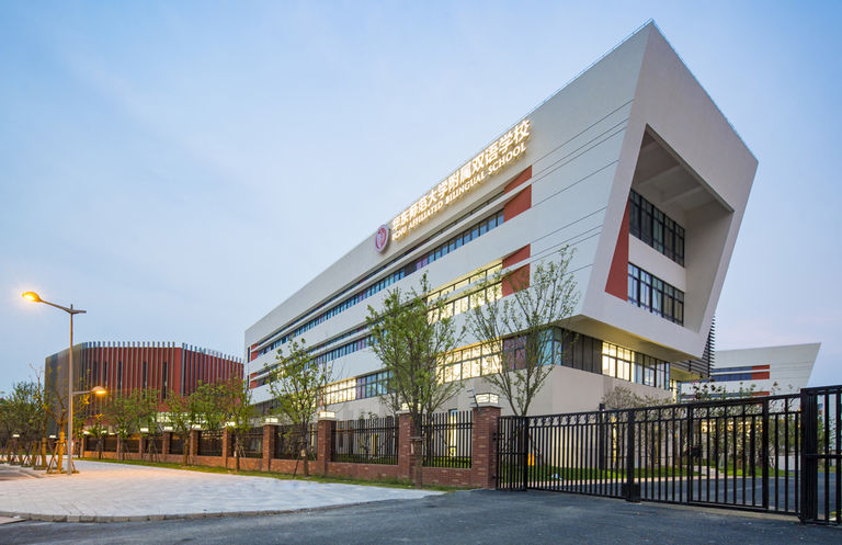 Exterior façade to Jiading School in Shanghai, showcasing elongated buildings with linear fenestration.